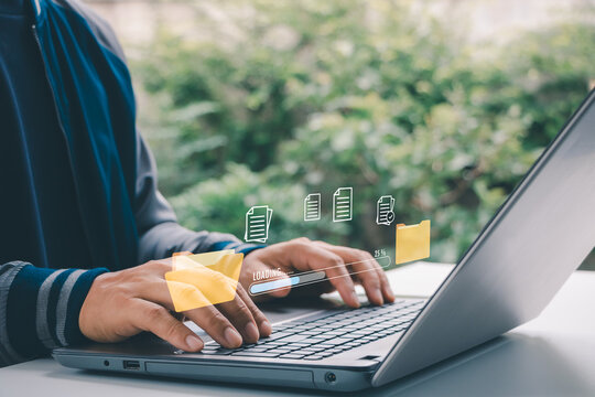 Digital file management concept with man using laptop, showing folder icons and data loading interface for cloud storage, document management, data transfer, backup system and business technology.