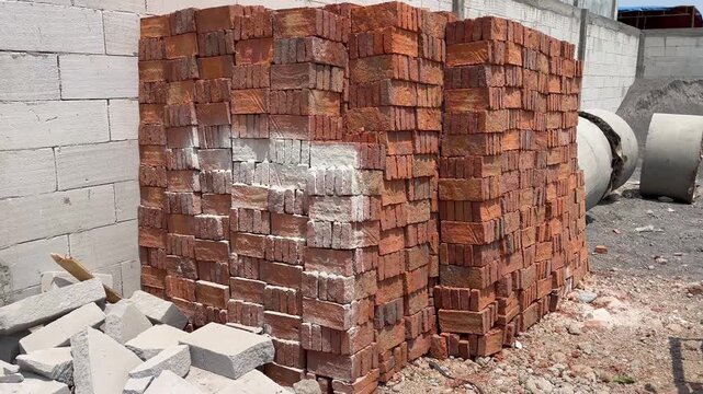 Stacked Red Bricks on Construction Site