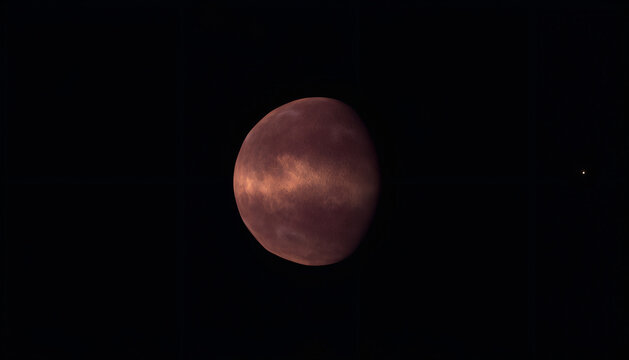 A textured reddish brown planet illuminated against the deep dark background of outer space