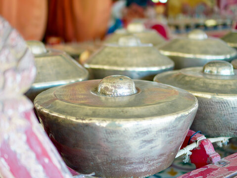 A detailed photo of traditional Javanese gamelan bonang kettles, reflecting the rich cultural heritage of Indonesian traditional instruments
