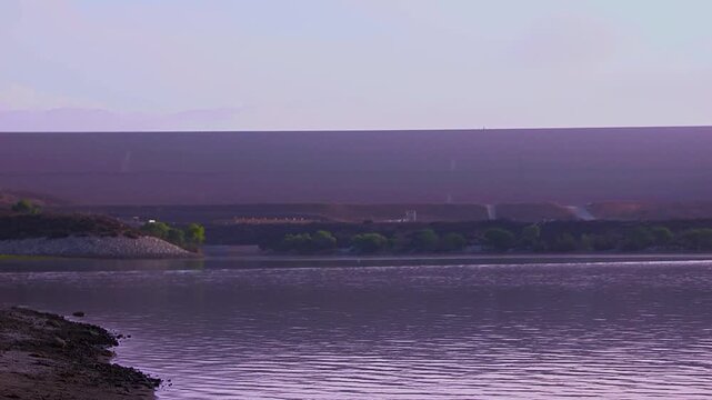 Calm water on a lake at sunrise