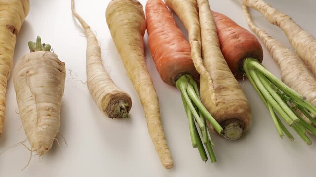 zoom winter vegetables parsnip carrot on ligt surface food