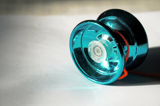 Colorful yo - yo with string for recreational play