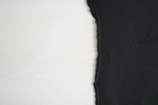 Black and white contrast of two different colored papers