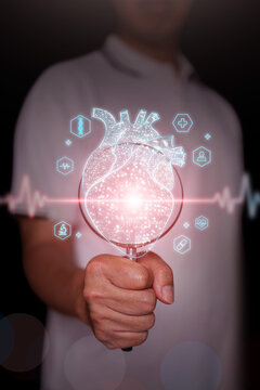 Hand holding magnifying glass focusing on glowing digital human heart with heartbeat ecg line and healthcare icons, Cardiology diagnostics, cardiovascular health, medical technology. Vertical photo.