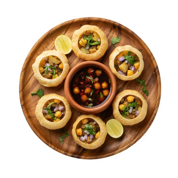 Pani puri street food served on wooden plate. Crispy hollow shells filled with chickpeas and potatoes. Includes tangy tamarind water bowl for dipping