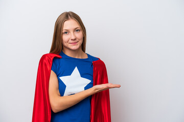 Super Hero Russian woman isolated on white background presenting an idea while looking smiling towards © luismolinero