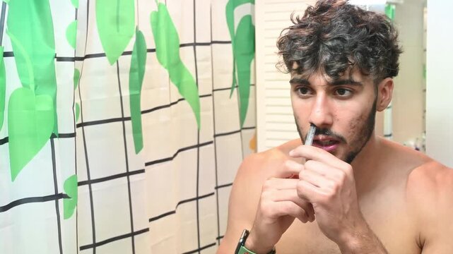 Young man with a syringe doing nasal wash, Selective and soft focus.