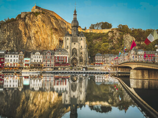 Dinant, 19.09.2026, Belgium, A beautiful view of the promenade and the Notre-Dame Collegiate Church. The City of Saxophones and the gateway to the Ardennes  © Bartomiej