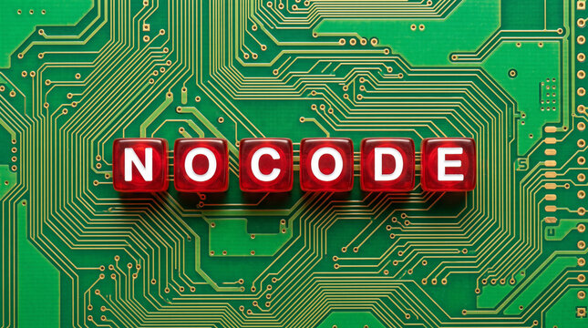 No code text spelled with red letter blocks on a green electronic circuit board
