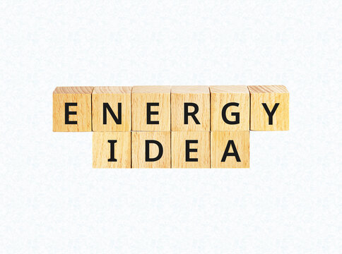 Energy idea wooden block letters on patterned light blue backdrop.
