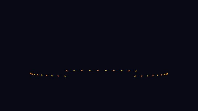 A line of glowing orange lights against a dark night background.
