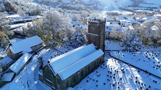 Snowy Chagford Church and Village Rooftops Aerial