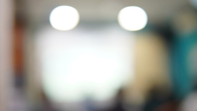 Abstract blurred indoor background with bright bokeh lights