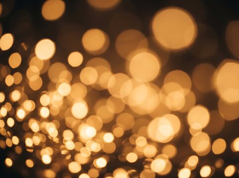 Golden bokeh background photo with glowing blurred light orbs and festive sparkle