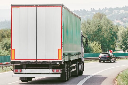 White truck driving on busy European freeway