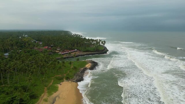    Drone View of Kappil Beach and Backwaters Surrounded by Tropical Landscape in Kerala, India