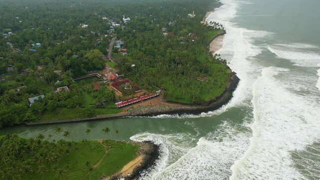     Aerial Drone View of the Coastal Road Between Kappil Lake and Arabian Sea, Kerala, India
