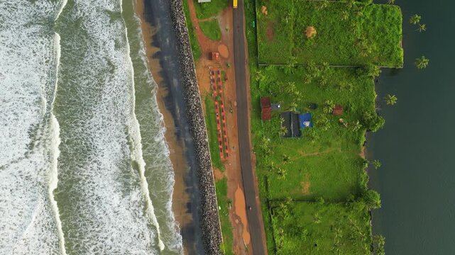     Cinematic Aerial View of Arabian Sea and Kappil Lake Separated by a Coastal Road, Kerala