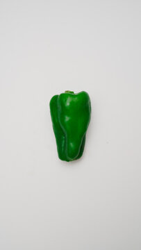 Green pepper on a neutral background