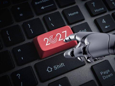 Robotic hand presses red 2027 key with target icon on computer keyboard. Artificial intelligence, automation, future planning, business strategy, new year goals, evolution and digital transformation.