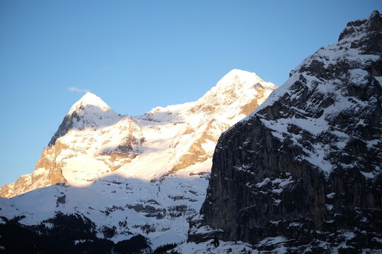 Sunlit snowy mountain peaks in Grindelwald