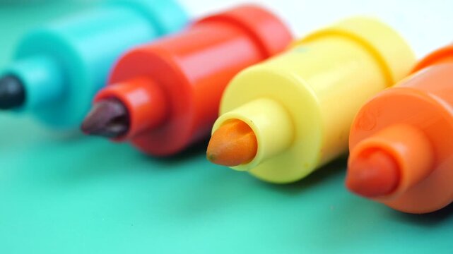 Row of colorful markers with felt tips, close-up, selective focus