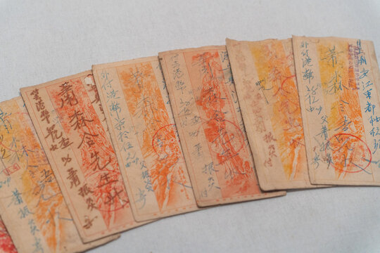 Vintage Chinese remittance vouchers with handwritten stamps