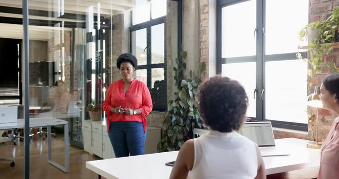 Lifestyle videos indoor of people doing activities at office, presenting business strategy, woman po