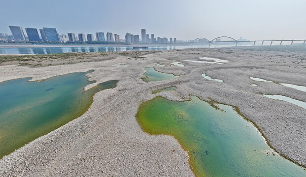 Dry Yangtze Riverbed with Exposed Section and City Skyline, Yichang China