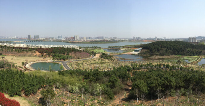 Zanglong Wetland Park Aerial View with Lakes and City Skyline