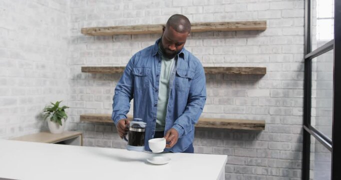 Lifestyle videos indoor of people doing activities at office, holding cup and saucer, man standing b