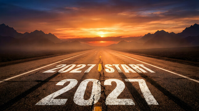 Road leading to the horizon with the year 2027 painted on the asphalt surface