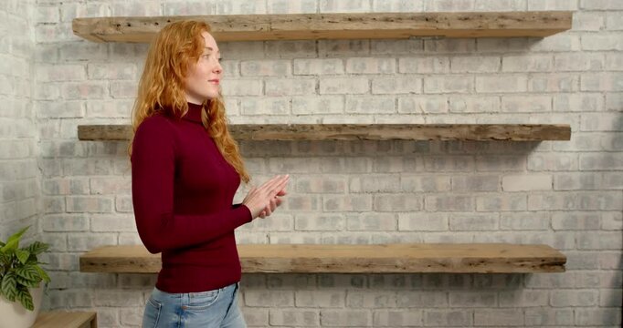 Close up of people talking to the camera, woman in casual clothing gesturing with hands