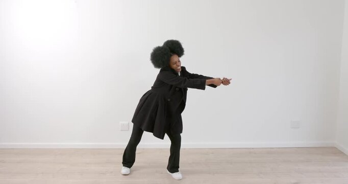 High speed photography for dynamic scenes, Dancing energetically, woman in black coat performing exp