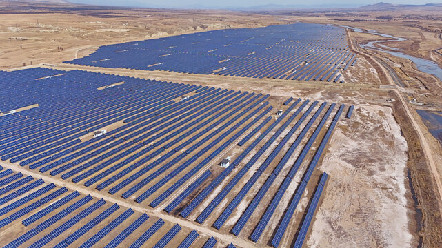 Aerial View of a Large Solar Farm in a Desert Landscape