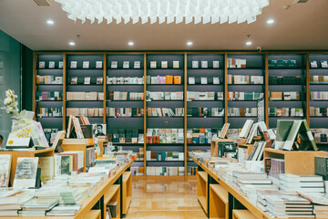 Quiet Modern Bookstore Interior with Shelves and Display Tables © LeVan