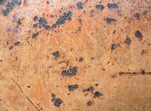 heavily rusted metal surface with deep corrosion spots background