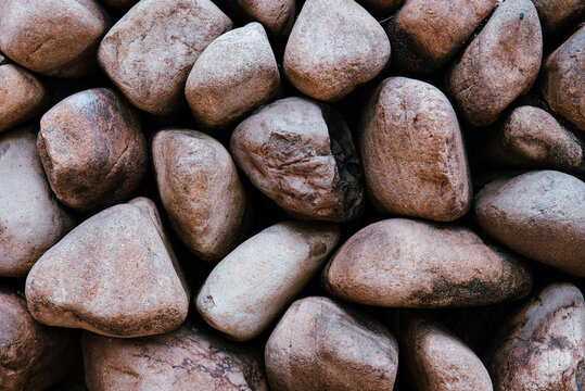 Close up texture of smooth river rocks and pebbles