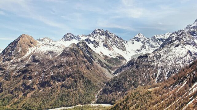Aerial view in the autumn season of Valmalenco with Pizzo Cassandra and Kennedy peak on background
