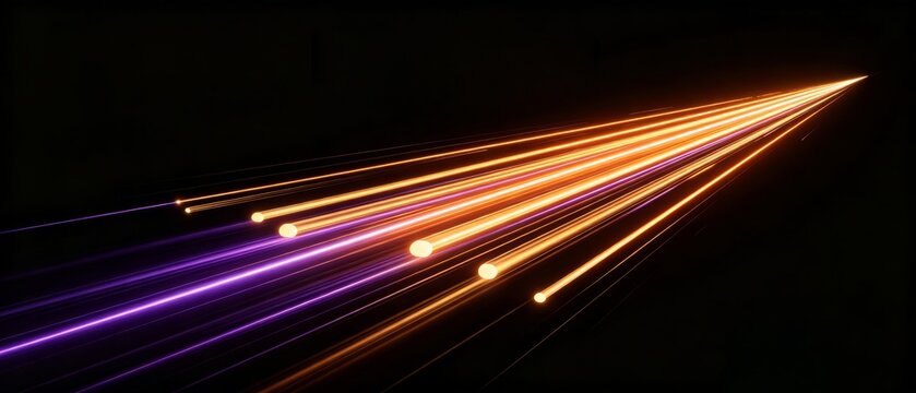 Glowing Light Streaks Moving Rapidly Against Dark Background