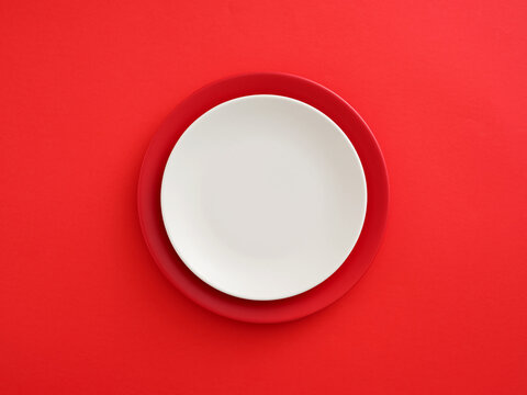 Red and white plates on a vibrant background
