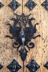 Wooden door with wrought iron details of The Sanctuary of The Vera Cruz in Caravaca de la Cruz town © SoniaBonet