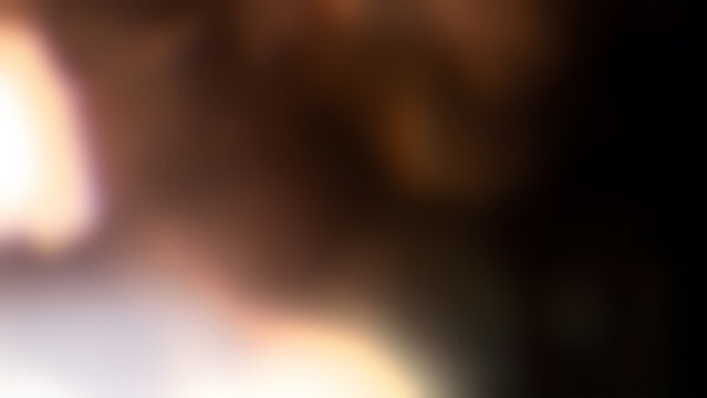 Abstract blurred background, with warm light, leaks and dark shadows