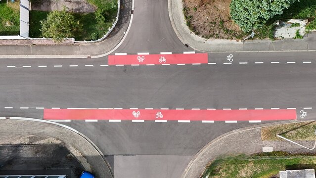 Aerial View of Red Bicycle Lanes at an Urban Road Intersection