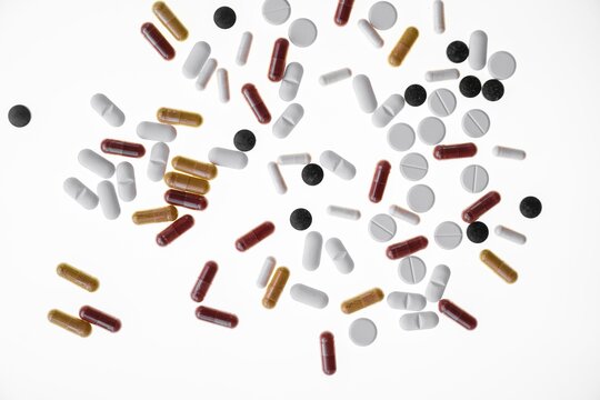 Colourful tablets, capsules, pills and drag&eacute;es, against a white background, Germany