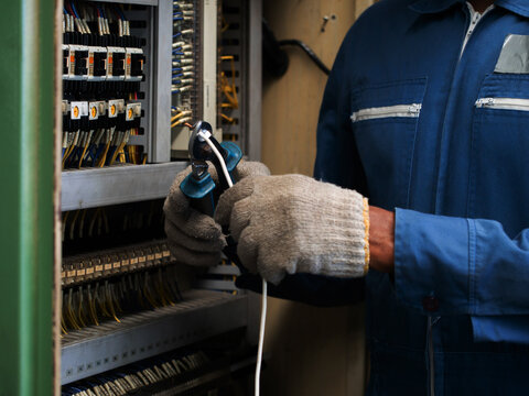 body part hand person people glove technical circuit service maintenance electric repair engineer industry equipment tool system voltage work job switch infrastructure testing fuse wiring energy power