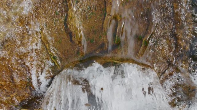 Commercial stock video clip highlighting fluid motion, transparent water foam, and natural stream elements. Suitable for water conservation projects, outdoor commercials, and atmospheric video product