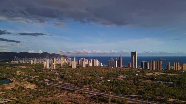 Aerial panorama of Benidorm skyline coastline and highways in Spain
