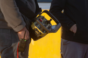 close-up of portable industrial radio remote control used for safely operating heavy machinery in hazardous environments © Olga